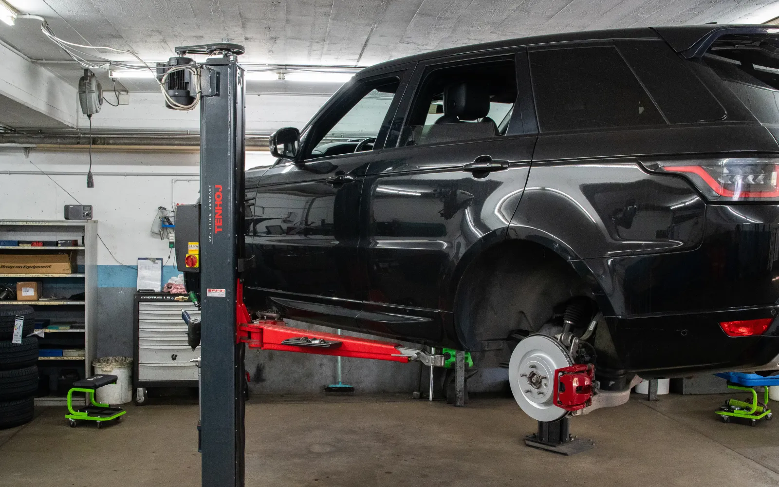 A vehicle on the lift in the mechanics workshop